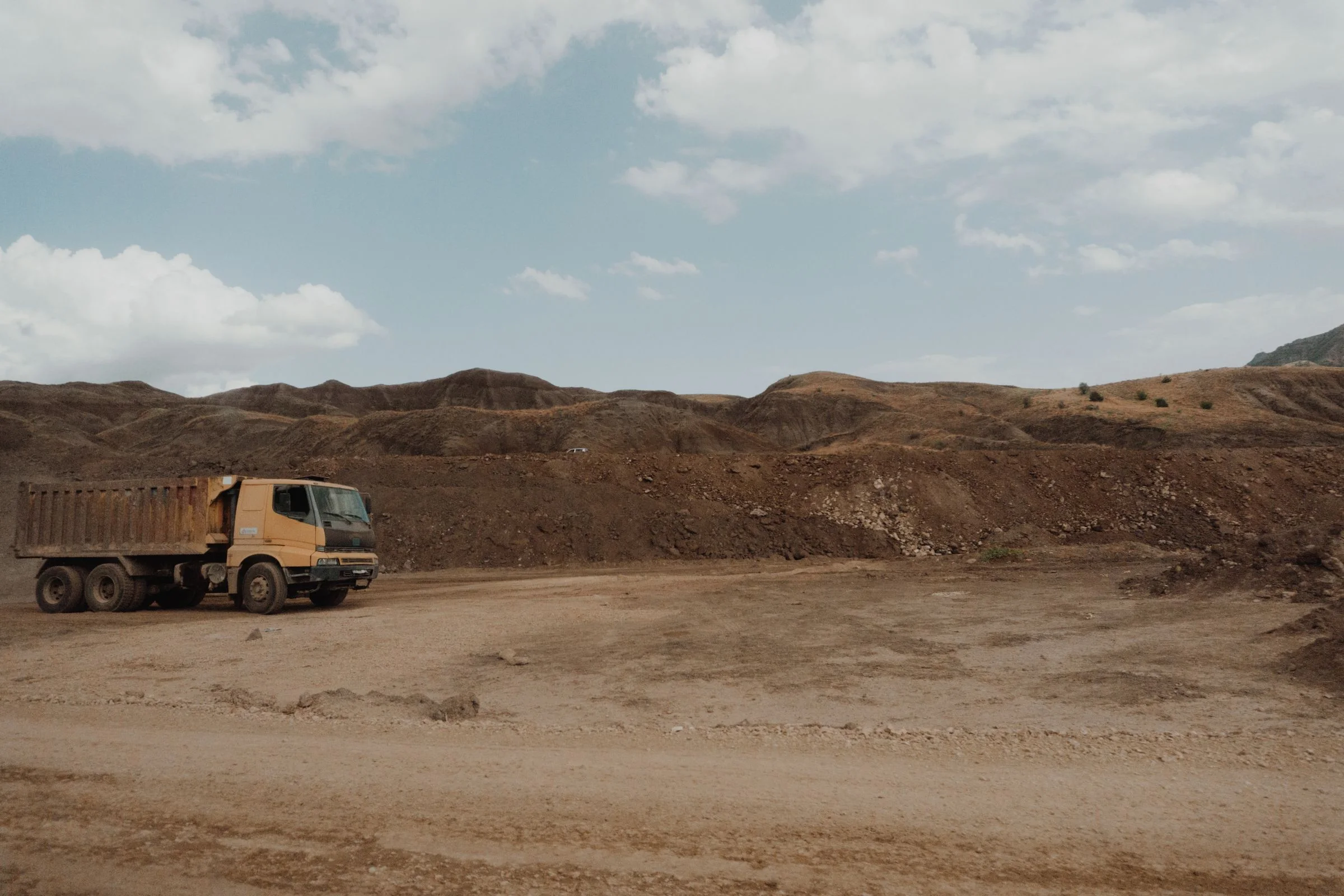 Illustrative industry photograph: dump truck on a quarry site